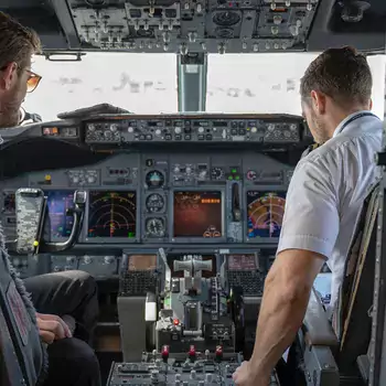 pilot and co-pilot in cockpit of airplane