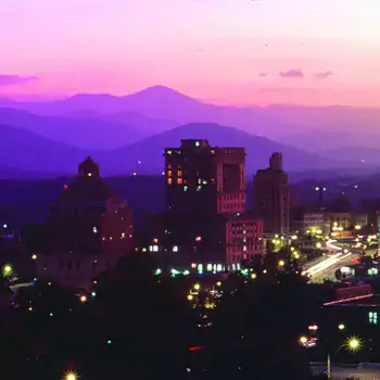 Asheville at dusk with purplish sunset.