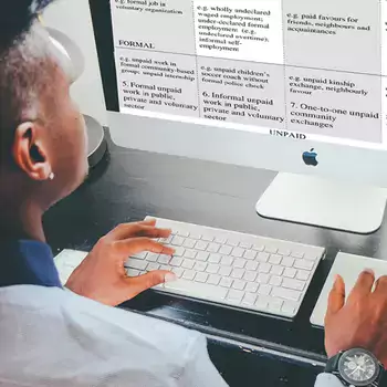 Student using a iMac desktop computer
