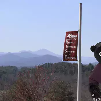 Trailblazer bear in front of mountain view