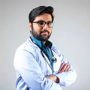 Male doctor with stethoscope wrapped around his neck