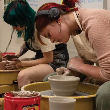 Students creating pottery