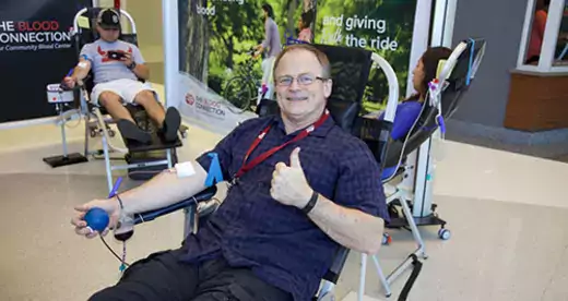 Donald Perkins giving blood at Blood Drive