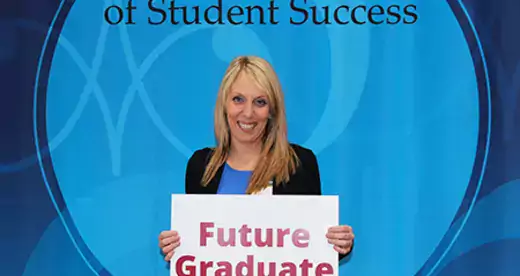 Bridget Cain holding sign that says Future Graduate
