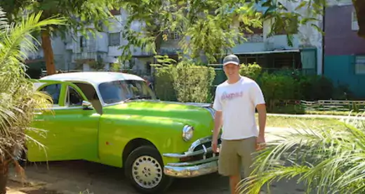 Man and green car