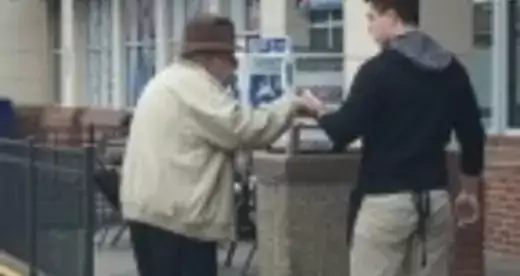 Michael Belanger walking with an elderly man