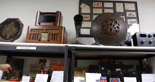 Antique radios on shelves