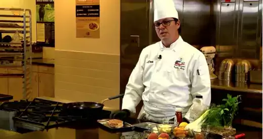 Chef standing behind a counter