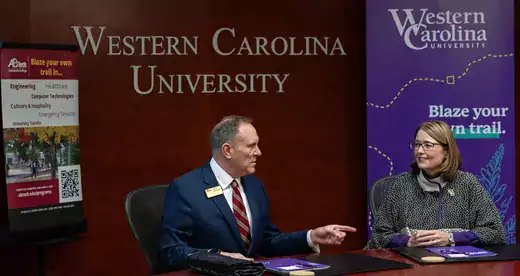 John Gossett, president of Asheville-Buncombe Technical Community College, and WCU Chancellor Kelli Brown signing an memorandum of understanding renewal between the two institutions.