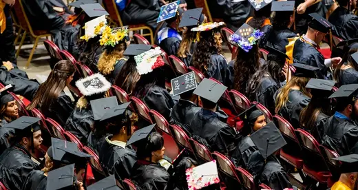 A-B Tech graduates sit inside Harrah's Cherokee Center during the university's graduation ceremony, May 10, 2025, in Asheville.
