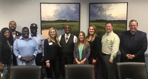 Group photo of Charlotte Works and members of the Sheriff's Office