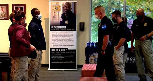 Law enforcement officers standing in lobby