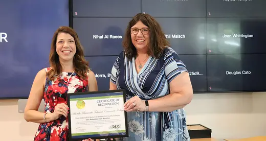 Elizabeth Bizer (left) awards A-B Tech Facilities Director Elizabeth Green with Energy Award 