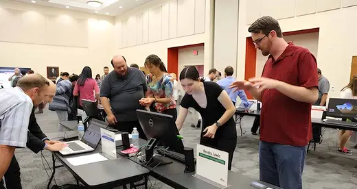Students looking at a computer