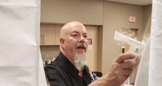 Anthony Green fitting face masks