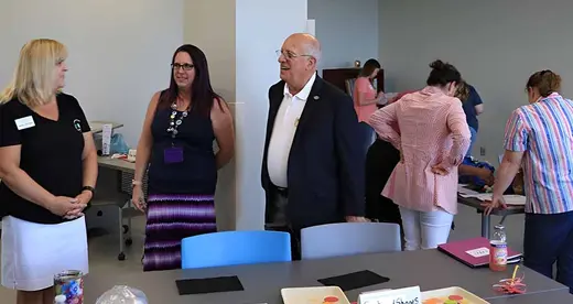 Dr. King talking to some teachers in the Early Childhood program