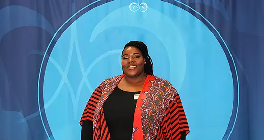 Marshay Proctor-Bates in front of blue background