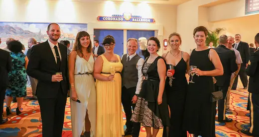 Five chefs with formal wear with coaches.