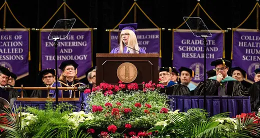 Mary Lewis at lectern