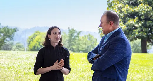 The region’s first culinary apprentice, Caitlyn Wright of Asheville, accepts congratulations from A-B Tech President John Gossett. Photo courtesy of A-