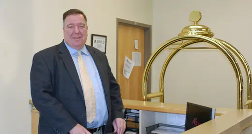 Walter Rapetski standing behind a desk