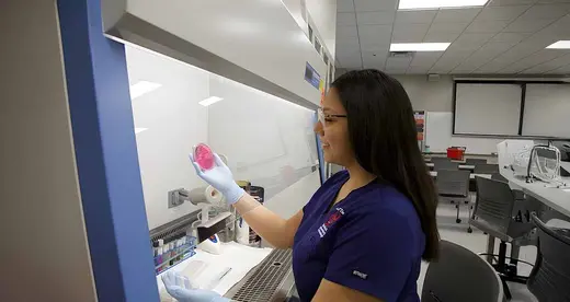 Med Lab Student with petri dish