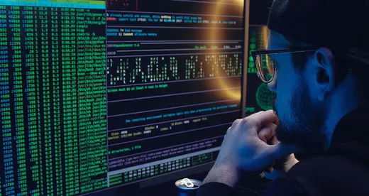 Man in front of computer screen