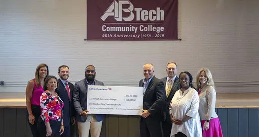 People holding oversize check