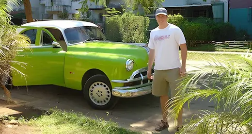 Man and green car