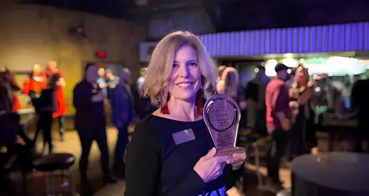 Jill Sparks holding Vanguard award