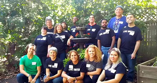 Group photo of people outside at United Ways Days of Impact event
