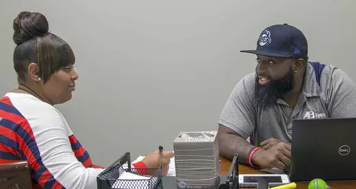 Philip Cooper and Michelle Hurst sitting at a table