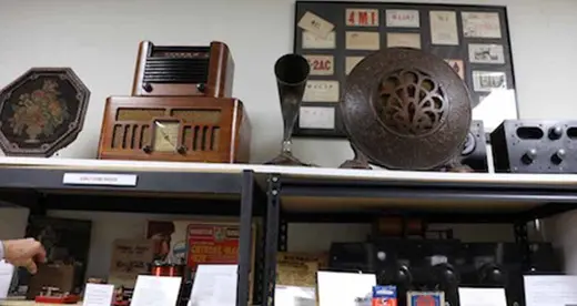 Antique radios on shelves