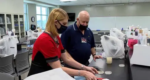 Dr. Wiener and Jennifer Emert from WLOS testing masks