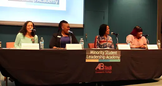 Four women sitting at a table