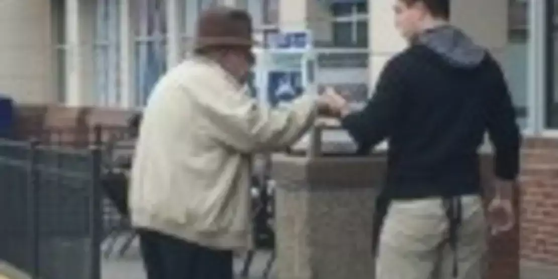 Michael Belanger walking with an elderly man
