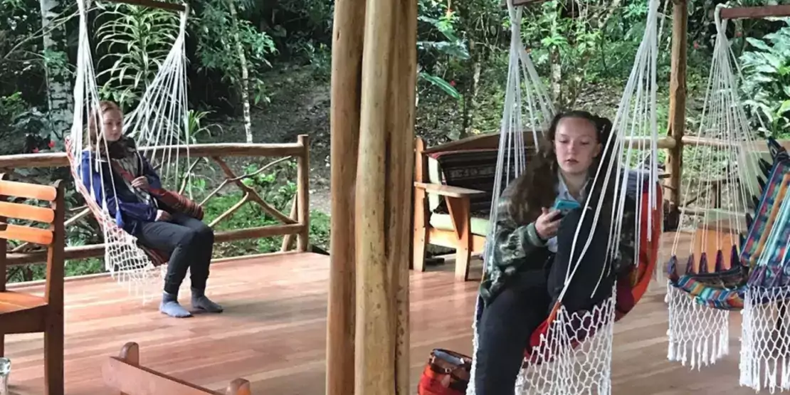 Students relaxing on a patio in Ecuador