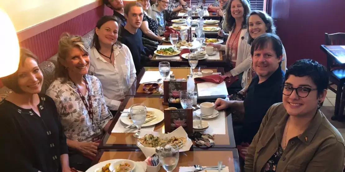 Group of people sitting at a table for lunch