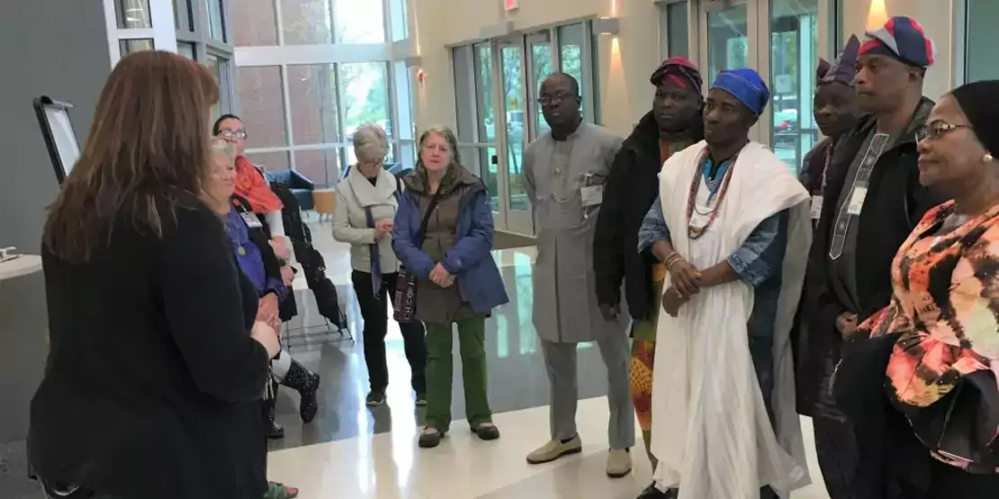 Woman talking to a group of people