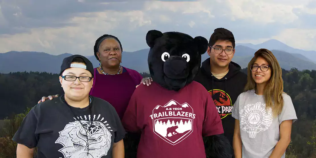 Students posing with the Trialblazer Bear showing diversity