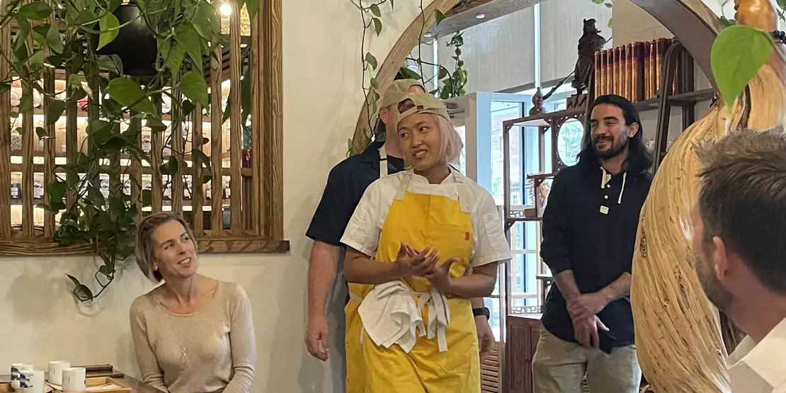 Woman in yellow apron in restaurant