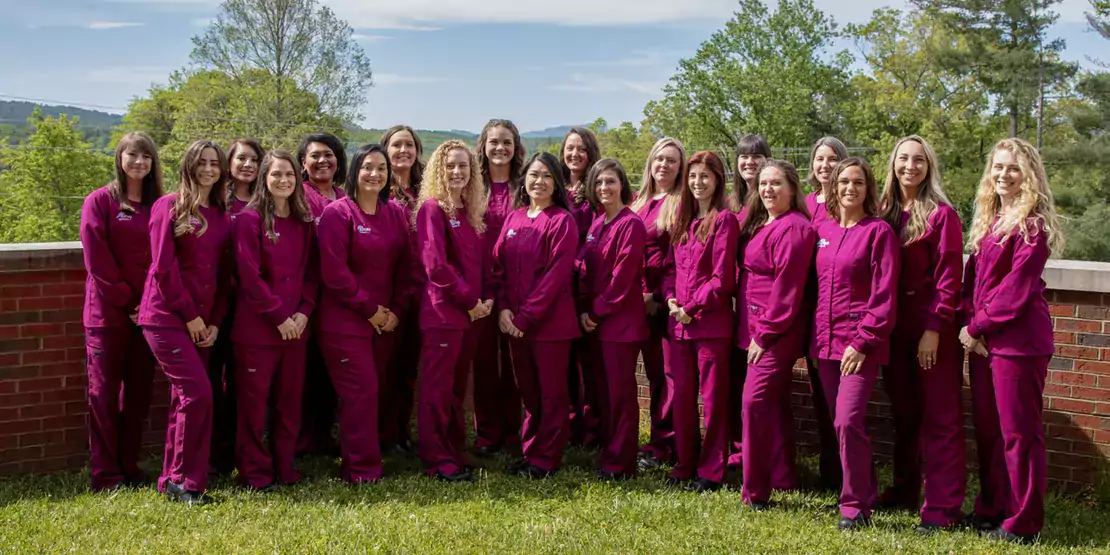 Group of Dental Hygiene students in caps and gowns