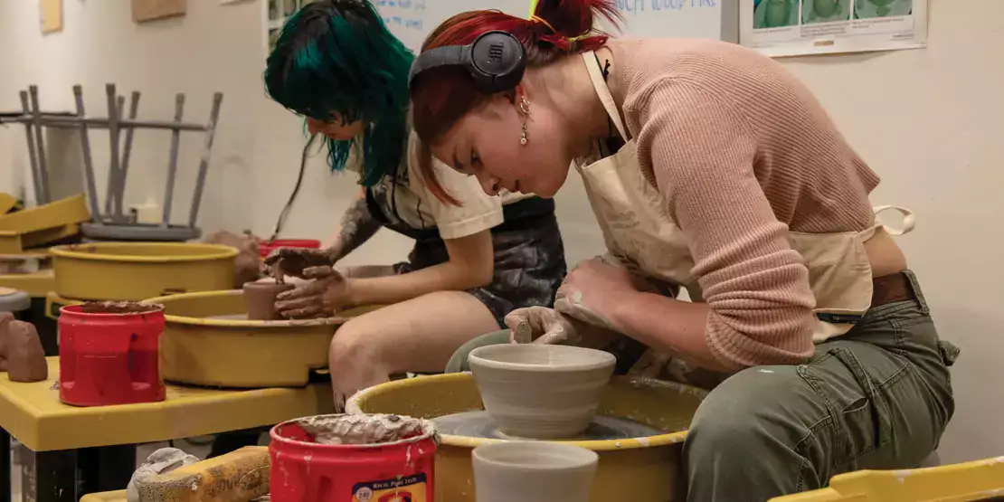 Students creating pottery