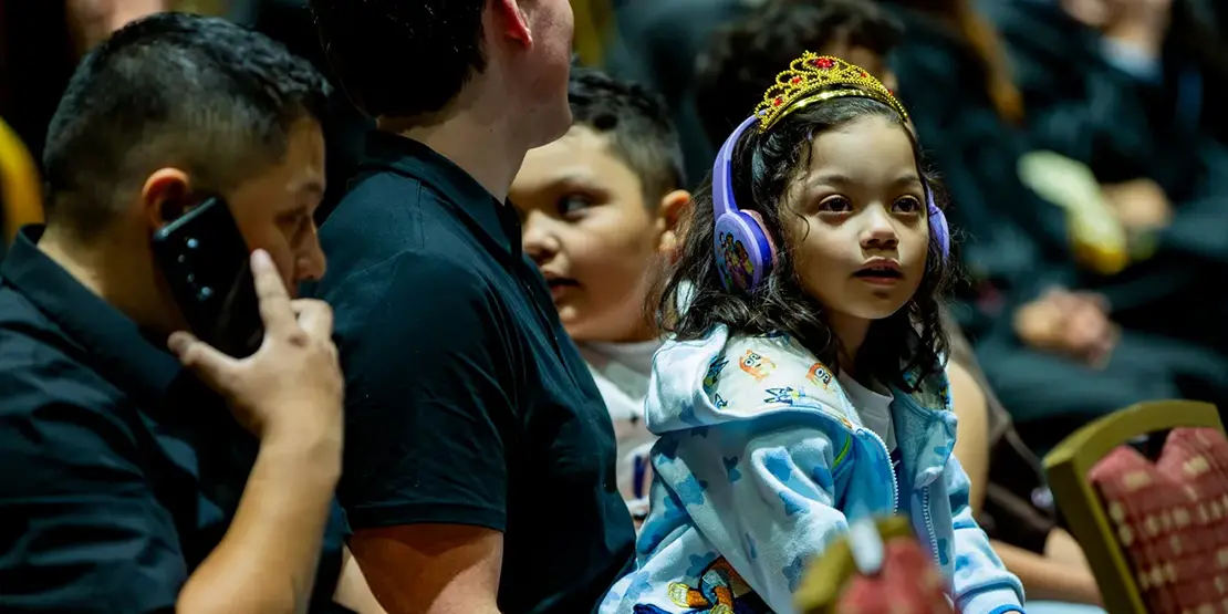 Family members look on during A-B Tech's graduation ceremony inside Harrah's Cherokee Center, May 10, 2025, in Asheville.