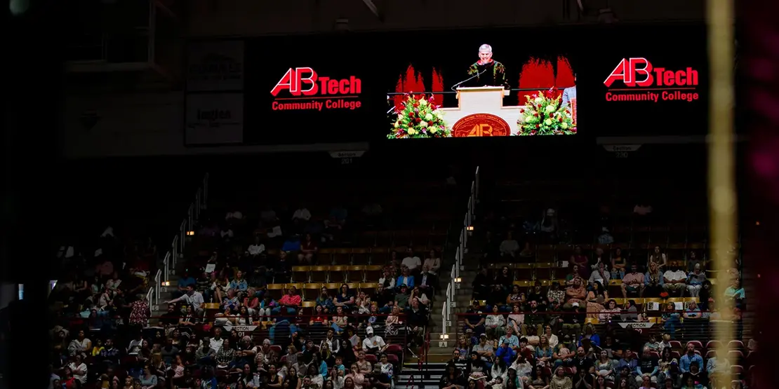 Gov. Josh Stein speaks inside Harrah's Cherokee Center during A-B Tech's graduation ceremony, May 10, 2025, in Asheville.