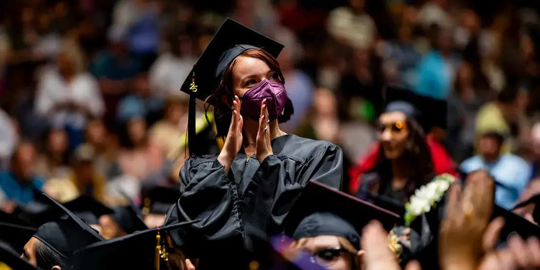 A-B Tech graduates listen as Gov. Josh Stein speaks inside Harrah's Cherokee Center during the university's graduation ceremony, May 10, 2025, in Asheville.
