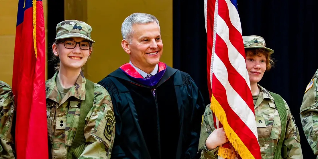 Gov. Josh Stein poses for photos with members of Owen High School's JROTC color guard ahead of A-B Tech's graduation ceremony inside Harrah's Cherokee Center, May 10, 2025, in Asheville.