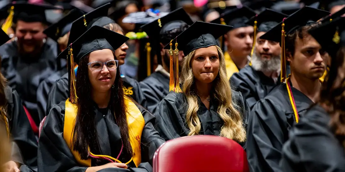 A-B Tech graduates sit inside Harrah's Cherokee Center during the university's graduation ceremony, May 10, 2025, in Asheville.