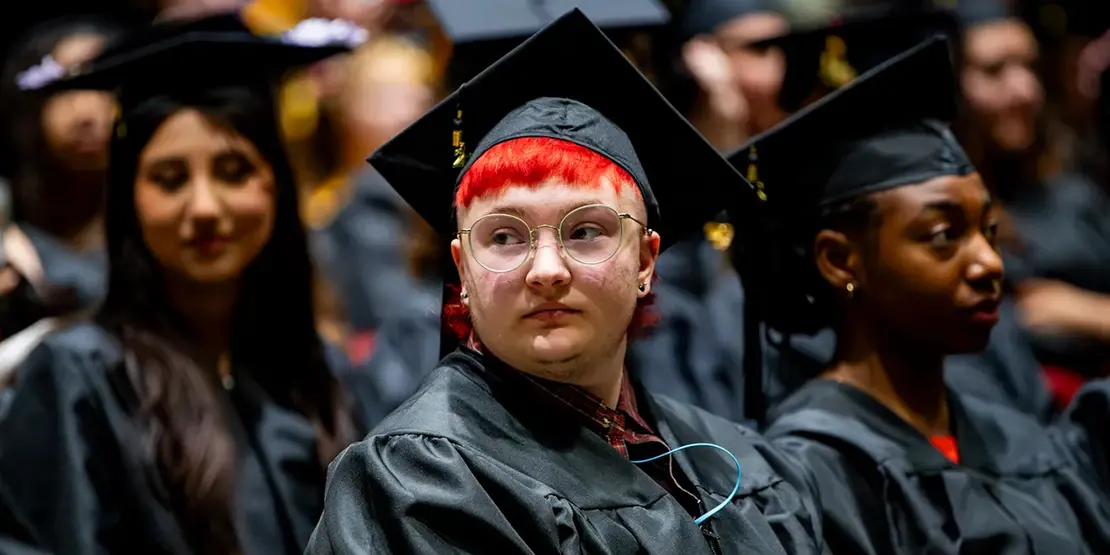 A-B Tech graduates sit inside Harrah's Cherokee Center during the university's graduation ceremony, May 10, 2025, in Asheville.