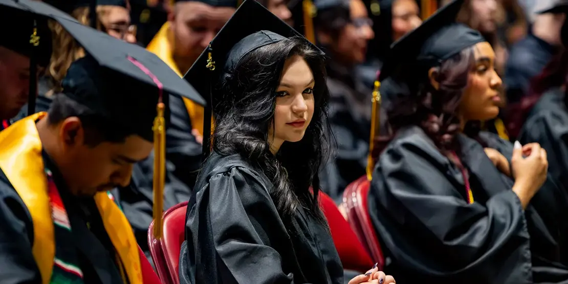 A-B Tech graduates sit inside Harrah's Cherokee Center during the university's graduation ceremony, May 10, 2025, in Asheville.